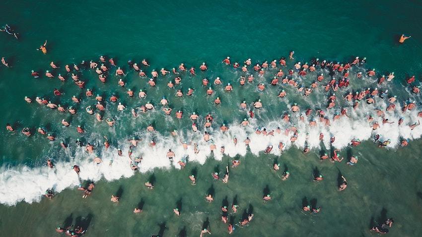 A crowd of swimmers, representing crowdfunding fundamentals