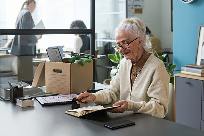 Senior Caucasian Woman Smiling While Reading Book