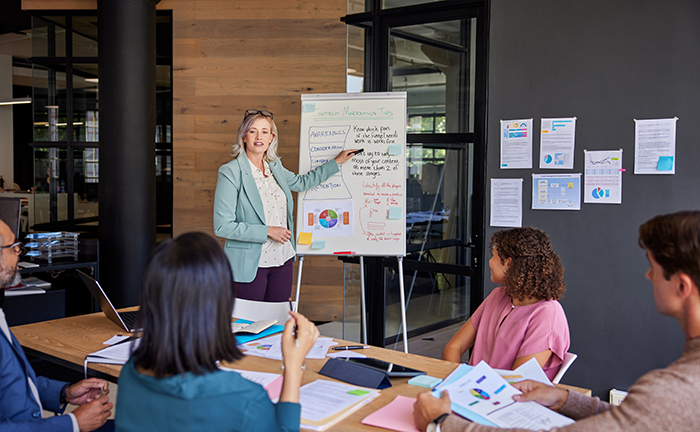 Adult woman giving business presentation